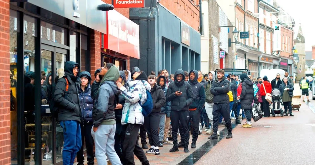 Long line of sneaker fans outside a store on a Jordan release day (